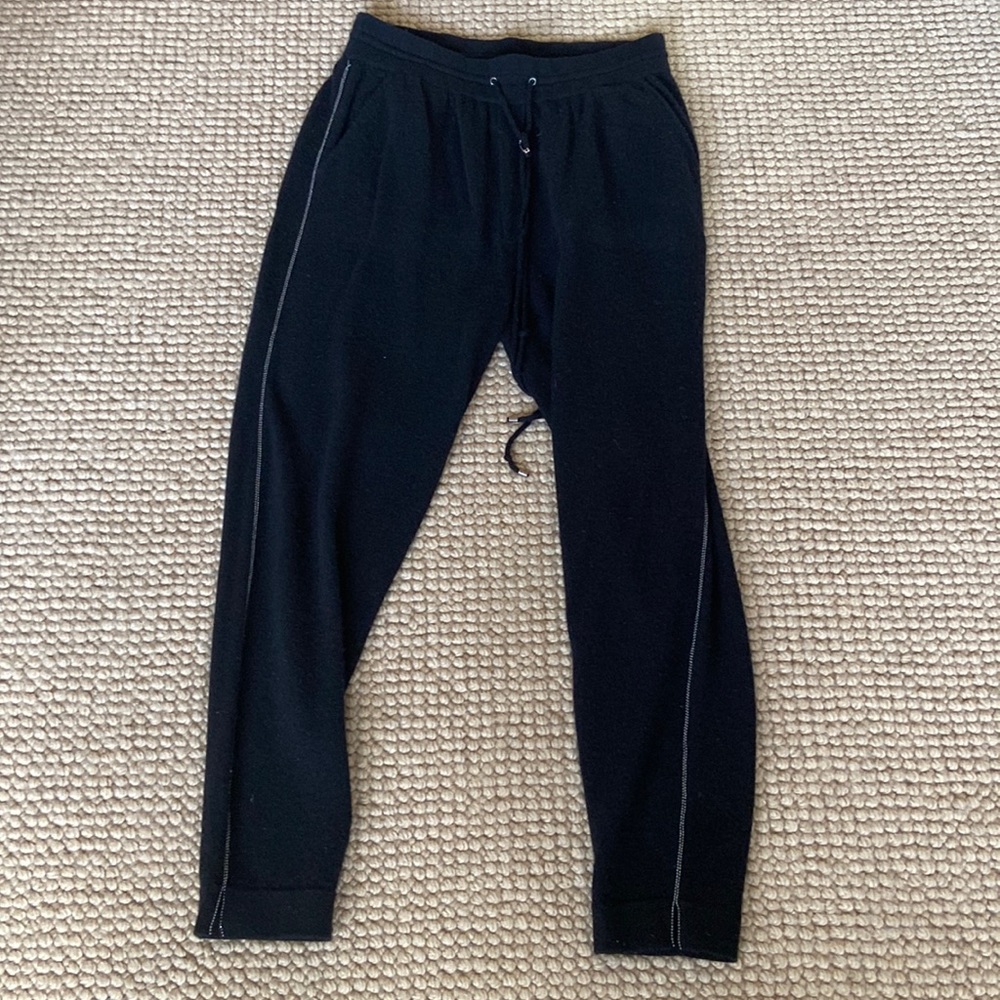 Neiman Marcus black cashmere joggers with beading detail down each leg.